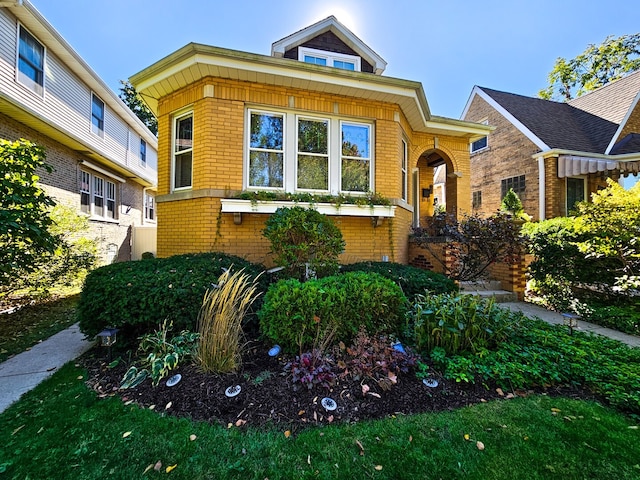 view of front of house with brick siding