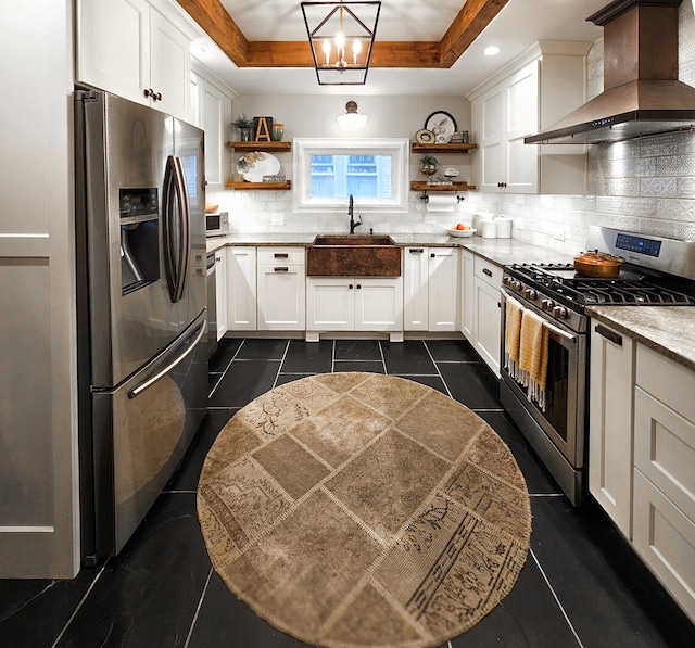 kitchen featuring stainless steel appliances, a tray ceiling, wall chimney range hood, and open shelves