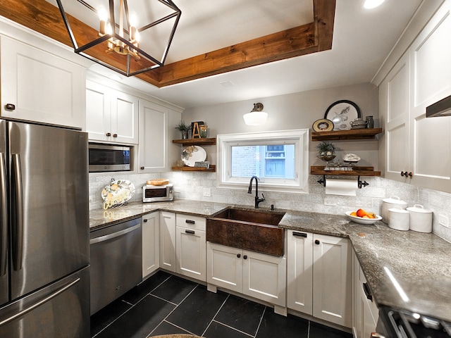 kitchen featuring open shelves, decorative backsplash, white cabinets, stainless steel appliances, and a sink