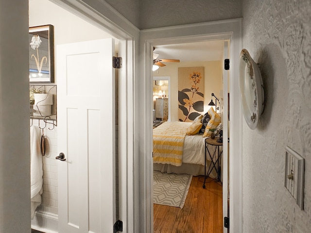 bedroom with wood finished floors and ensuite bathroom