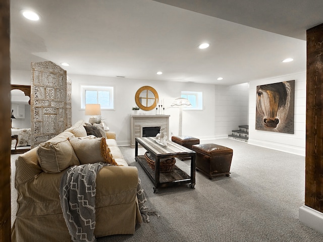 living area with carpet, recessed lighting, and a fireplace