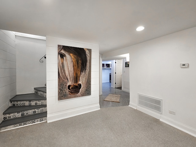 corridor with recessed lighting, visible vents, and baseboards