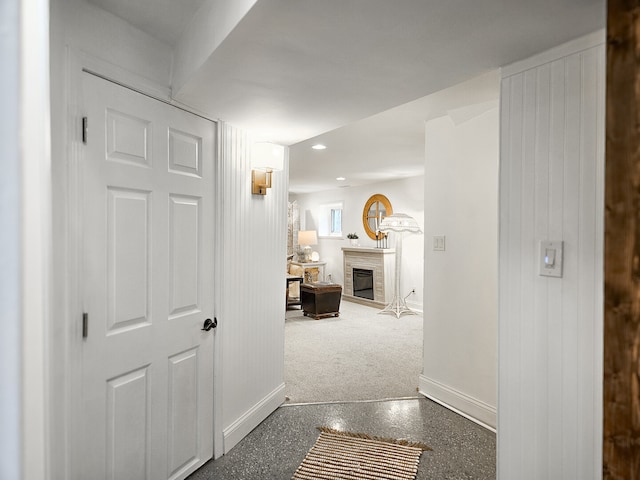 corridor featuring recessed lighting and baseboards