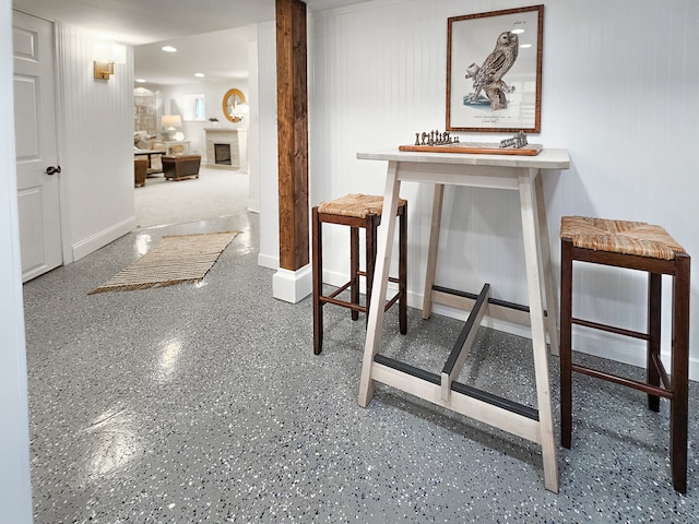 hallway with recessed lighting and baseboards