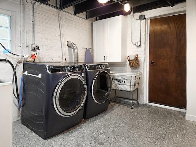 laundry area featuring cabinet space and separate washer and dryer