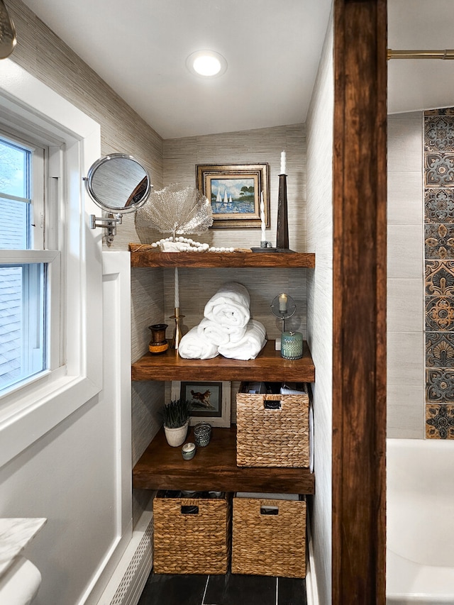 bathroom with tile patterned flooring and baseboards