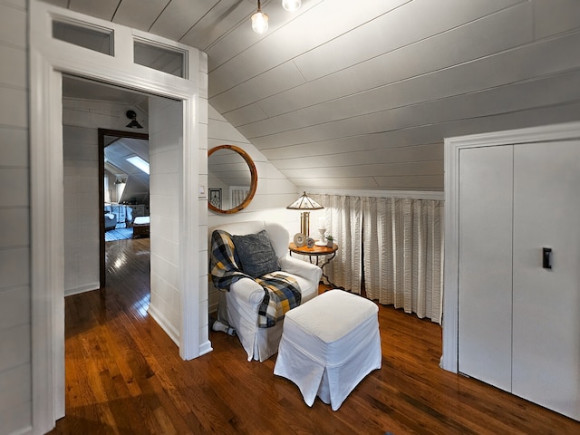 sitting room featuring vaulted ceiling, wooden ceiling, and hardwood / wood-style flooring