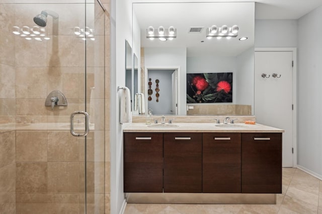 bathroom with a sink, visible vents, double vanity, and a shower stall