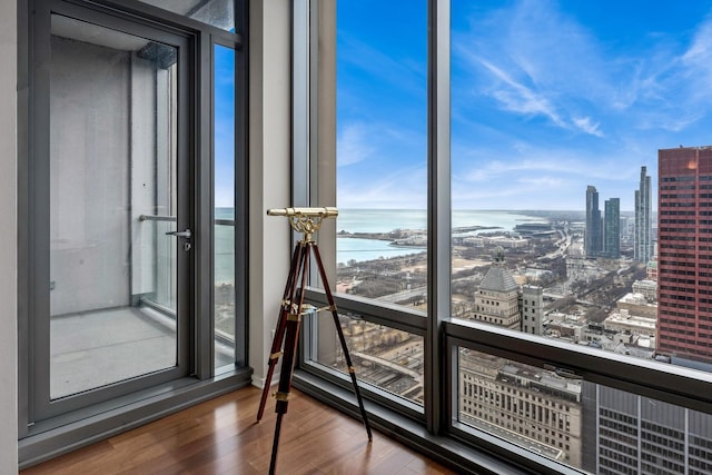 interior space featuring a view of city and a water view