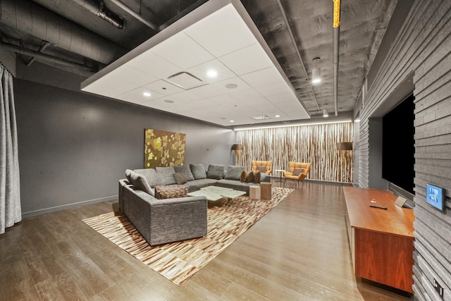 living area featuring wood finished floors and baseboards