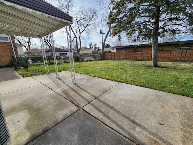 view of patio featuring fence