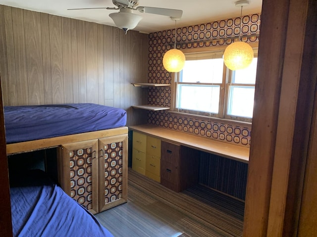 bedroom with ceiling fan and wood finished floors