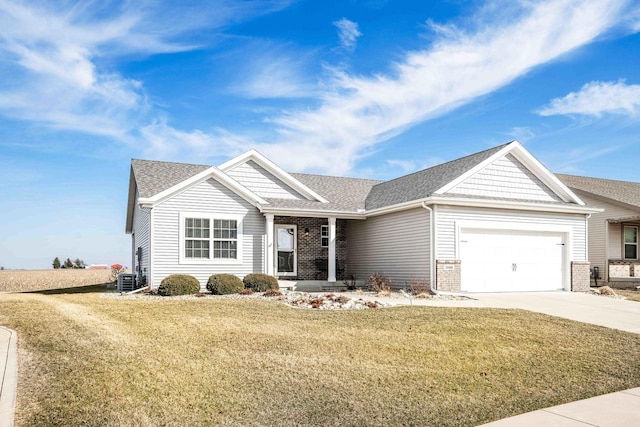 ranch-style home featuring concrete driveway, a garage, a front yard, and roof with shingles