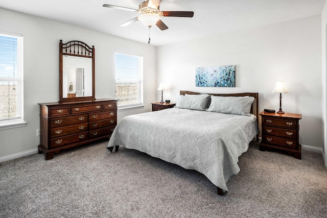 carpeted bedroom with a ceiling fan and baseboards