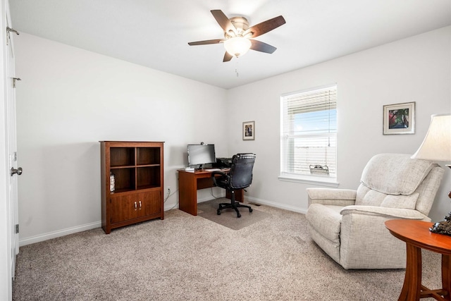 office with a ceiling fan, carpet, and baseboards