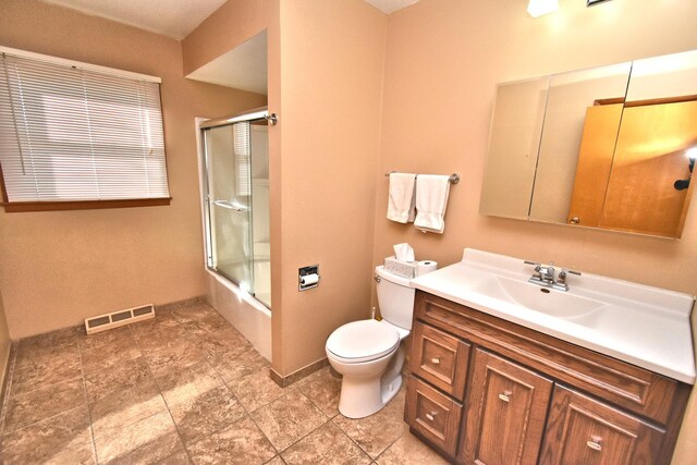 full bath with baseboards, toilet, and vanity