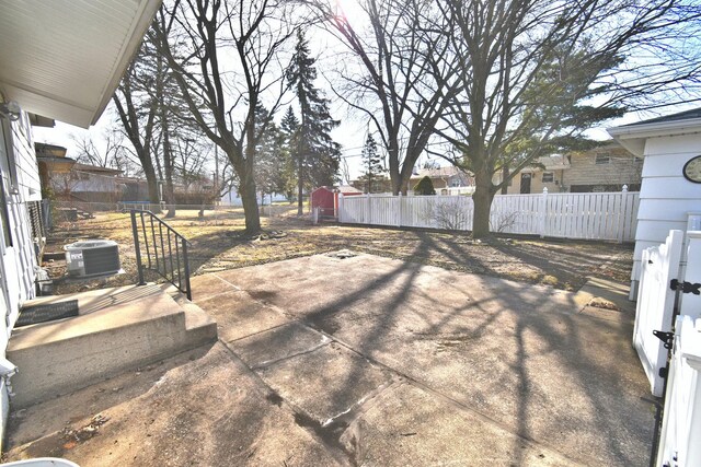 detached garage with a gate and fence