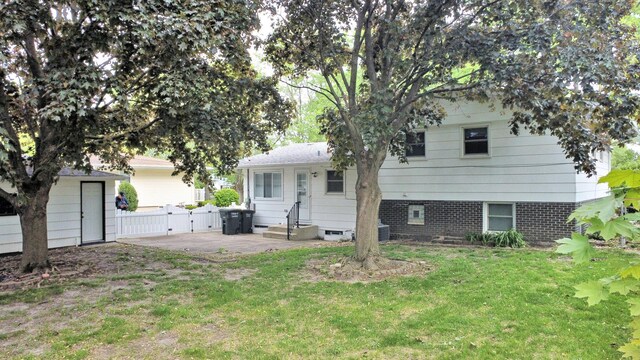 3003 191st St, Lansing, IL 60438 - back of property with a gate and entry steps