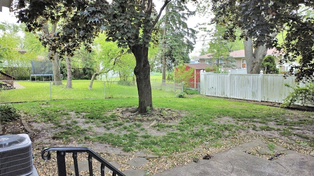 3003 191st St, Lansing, IL 60438 - view of yard featuring a trampoline and central AC unit