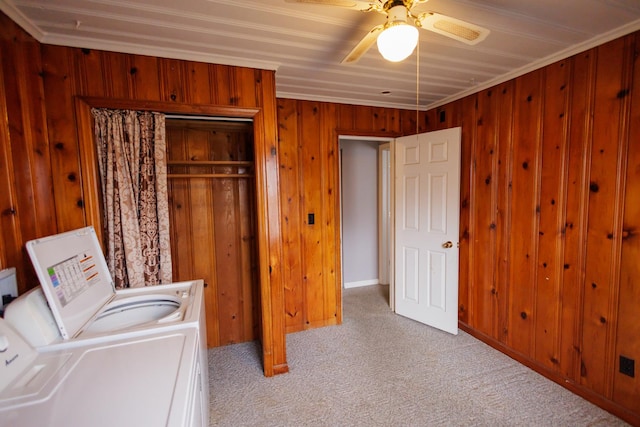 laundry area with a ceiling fan, washing machine and dryer, carpet flooring, and laundry area