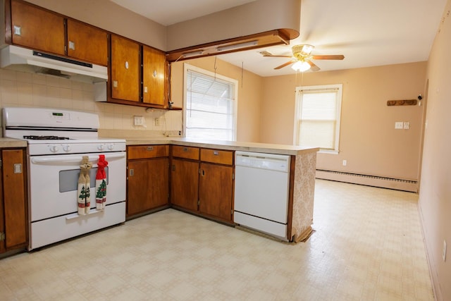 kitchen with under cabinet range hood, light floors, white appliances, and a baseboard heating unit