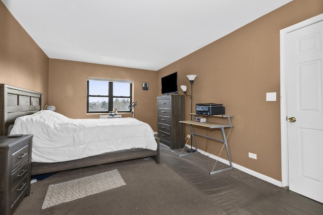 carpeted bedroom featuring baseboards