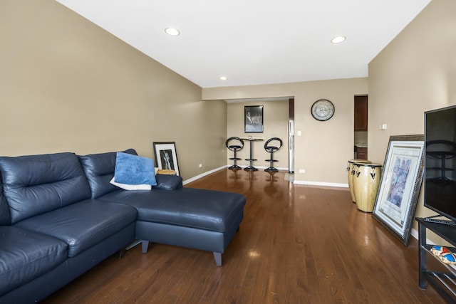 living area featuring recessed lighting, baseboards, and wood finished floors