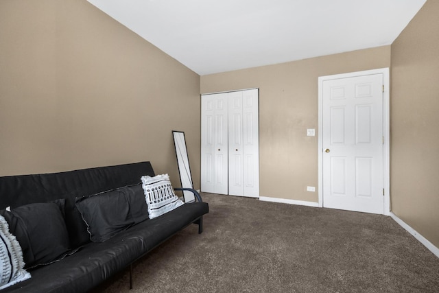 carpeted living room featuring baseboards