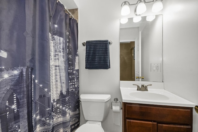 full bath featuring toilet and vanity