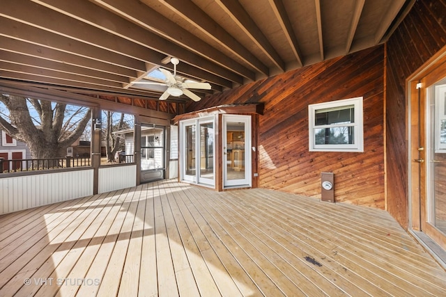 wooden deck featuring ceiling fan