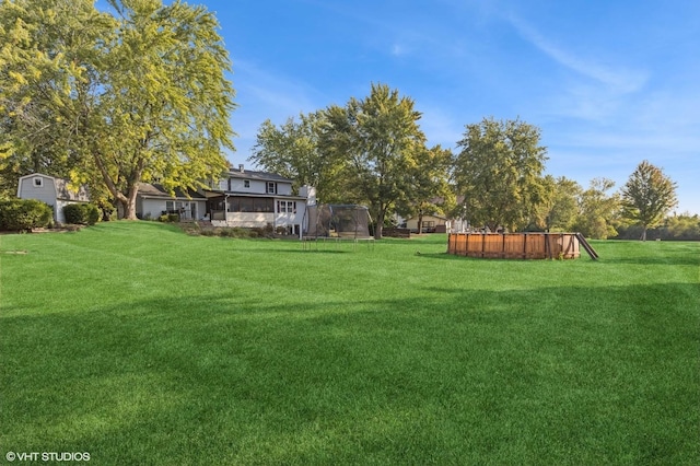 view of yard with a trampoline