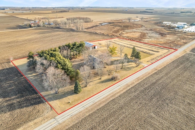 birds eye view of property with a rural view