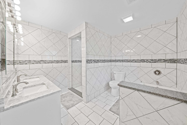 full bath with toilet, tile walls, walk in shower, and double vanity