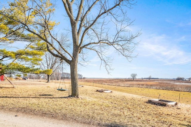 view of yard with a rural view