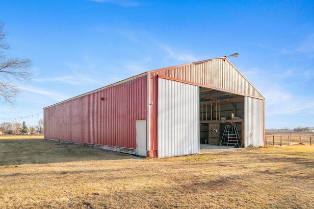 view of pole building with a yard