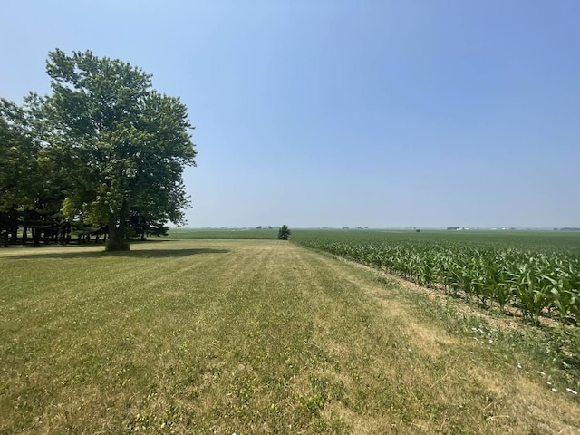 view of yard with a rural view