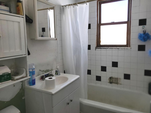 bathroom with shower / bath combination with curtain, vanity, and toilet