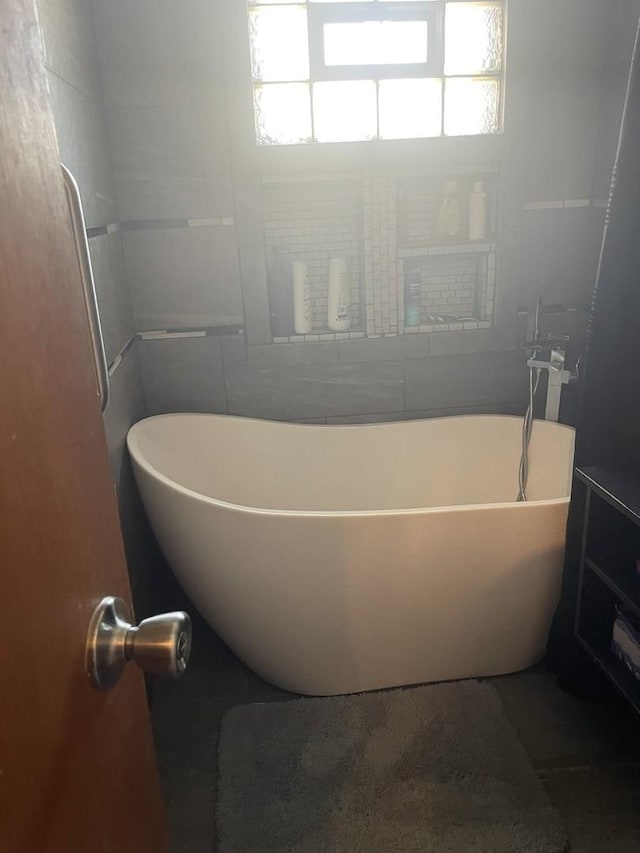 full bathroom featuring a soaking tub