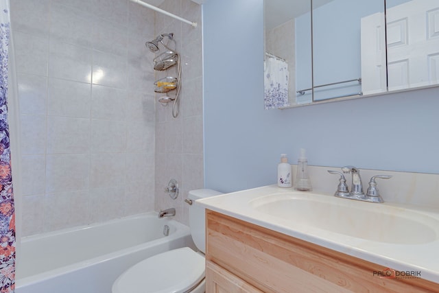 bathroom with vanity, toilet, and shower / bath combo with shower curtain