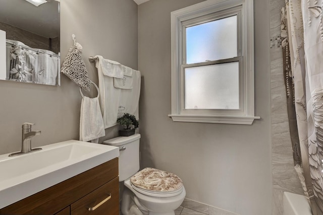 bathroom featuring toilet and vanity