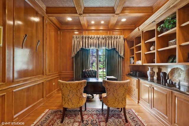 office space featuring light wood-type flooring, beamed ceiling, wooden walls, and coffered ceiling