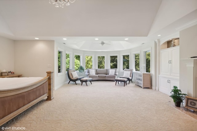 carpeted bedroom featuring a raised ceiling, a notable chandelier, recessed lighting, and baseboards