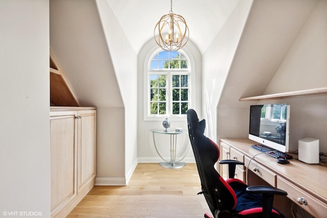 office featuring a notable chandelier, baseboards, light wood-style floors, and lofted ceiling