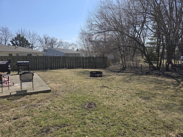 view of yard with a patio, an outdoor fire pit, and fence