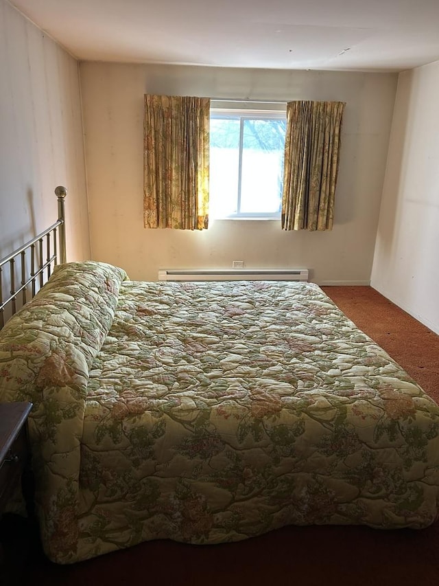 carpeted bedroom featuring a baseboard radiator