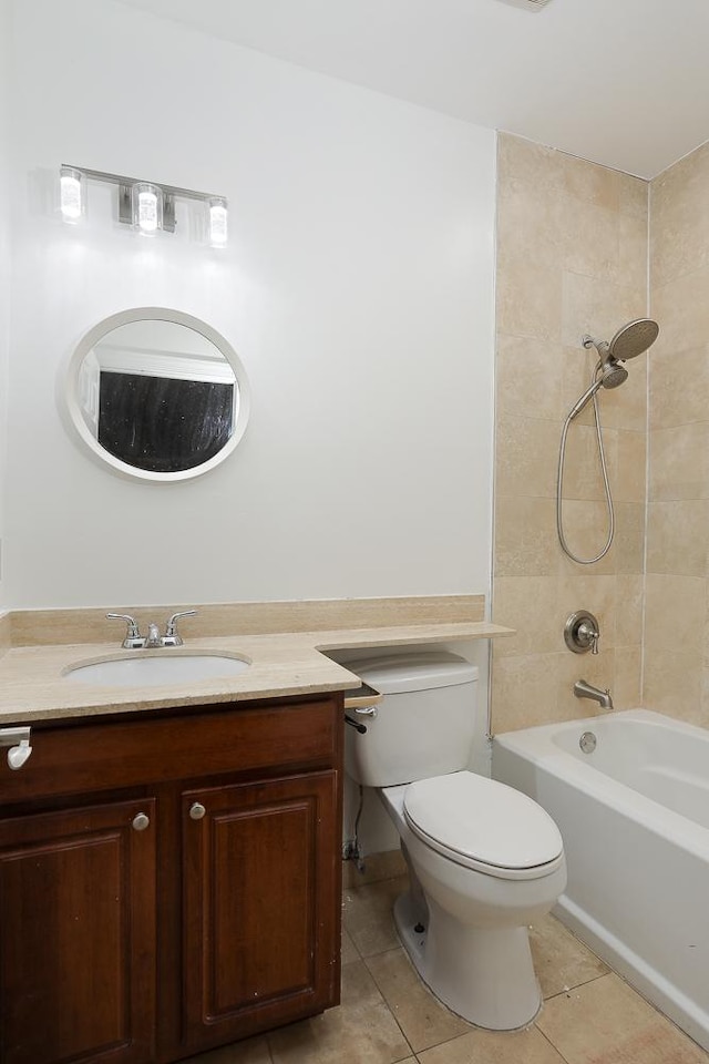 bathroom with vanity, tile patterned floors, toilet, and bathtub / shower combination