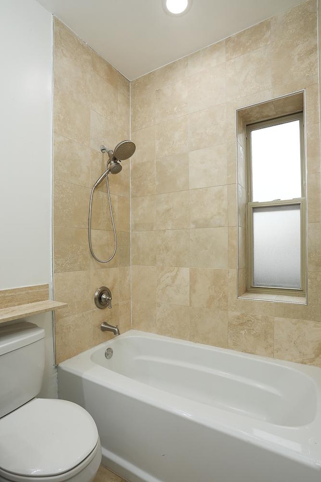 bathroom with toilet and shower / washtub combination