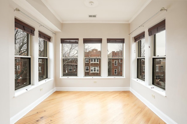 unfurnished sunroom featuring visible vents