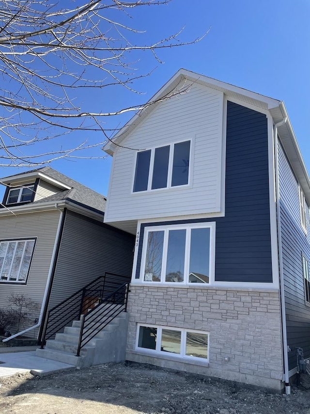 exterior space with stone siding