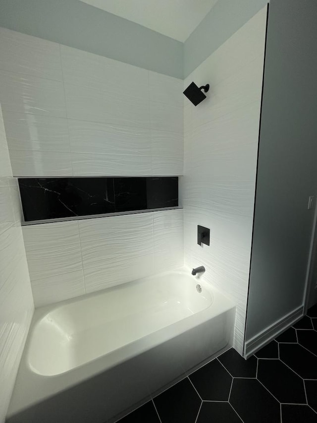 full bath featuring tile patterned floors and shower / bathtub combination